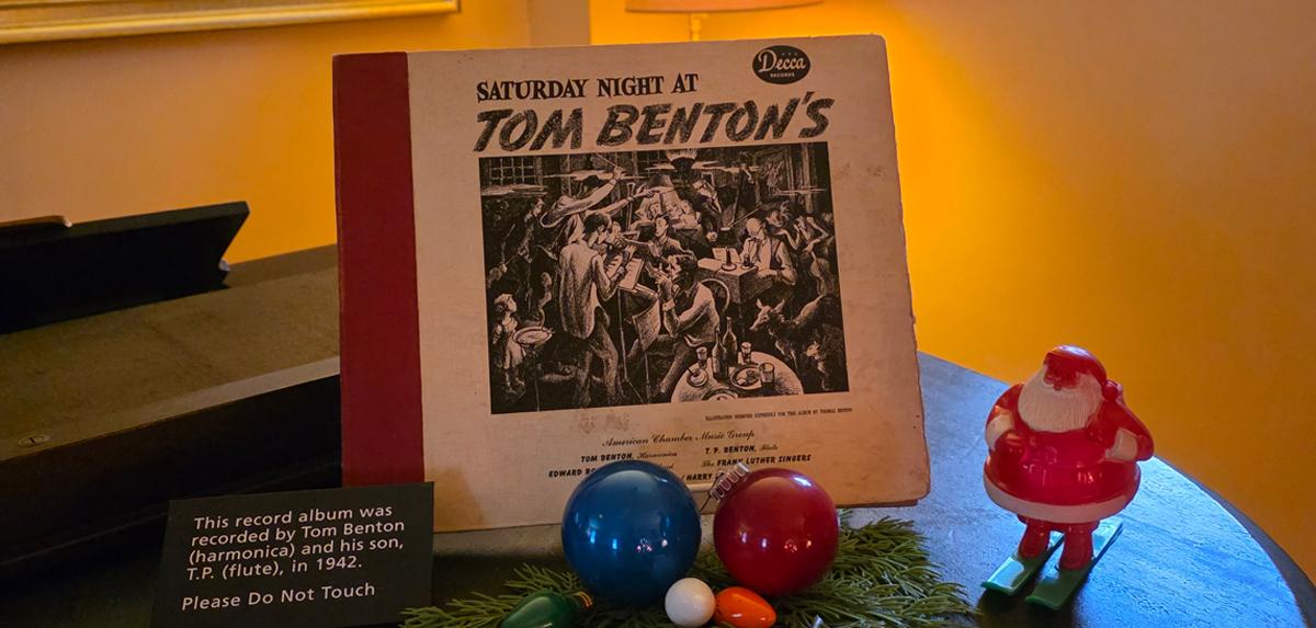 Table containing a record and holiday decorations.