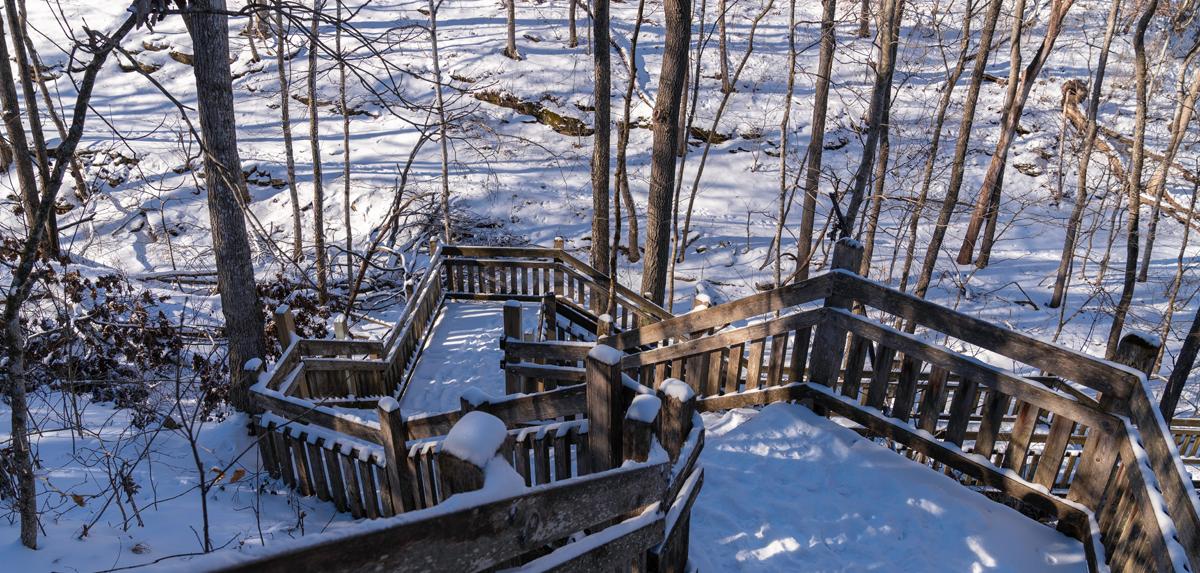 Outdoor wooden walkway with snow.
