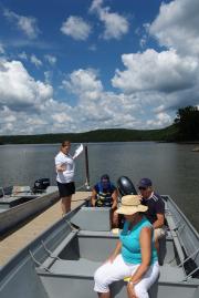 People getting in a boat at the boat dock
