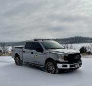Truck in Field with Snow