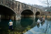 Historic stone bridge over river.