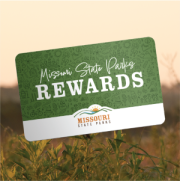 Image of a Missouri State Parks rewards card superimposed over a field bathed in golden sunlight